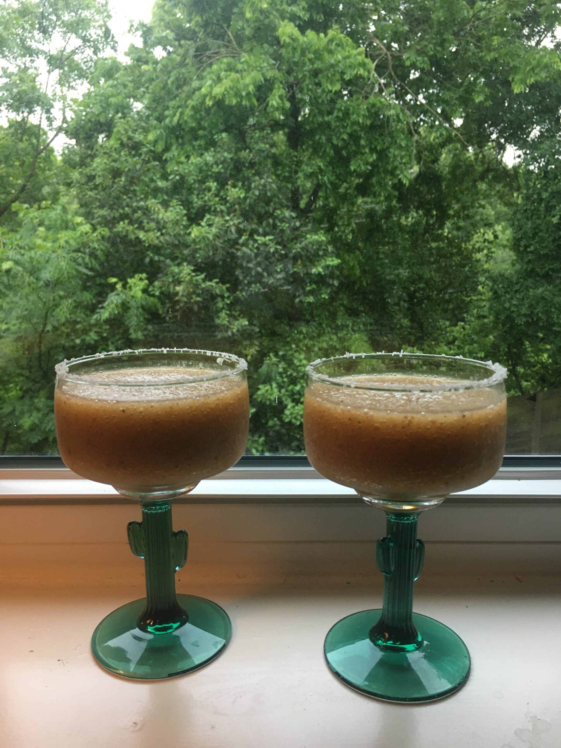 two loquatritas on a windowsill